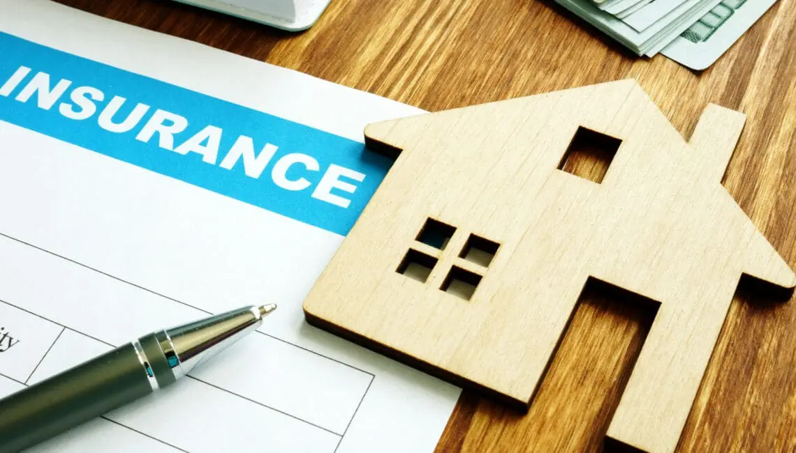 House insurance form for homeowners and model of home.